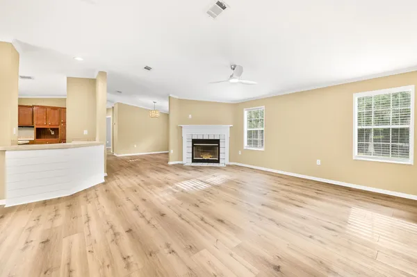 a kitchen with granite countertop wooden cabinets and a stove top oven