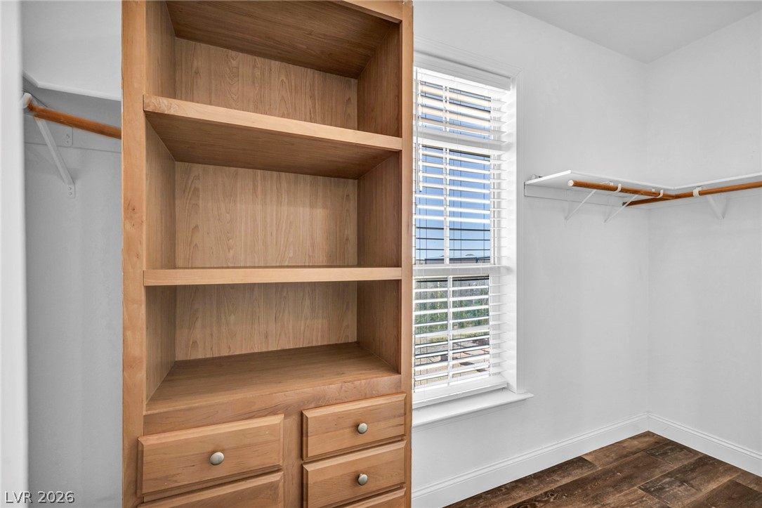 225 California Street Searchlight, NV 89046 - Photo 52 of 64 Custom built-in shelving offers smart storage within this sun-lit closet space.