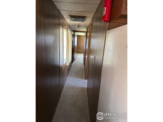 a room with a sink cabinets and a window