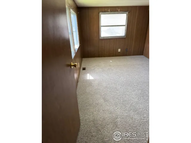 a kitchen with a refrigerator sink and cabinets