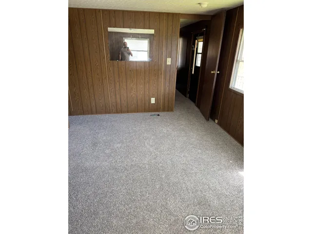 a view of a room with a large window