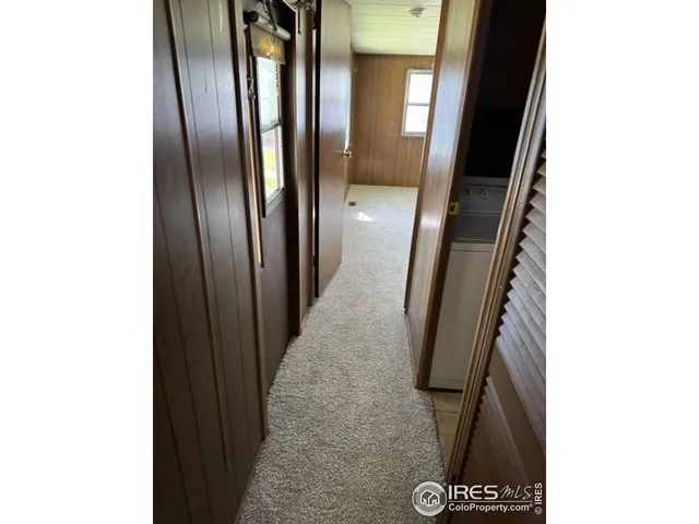 a view of an empty room with windows