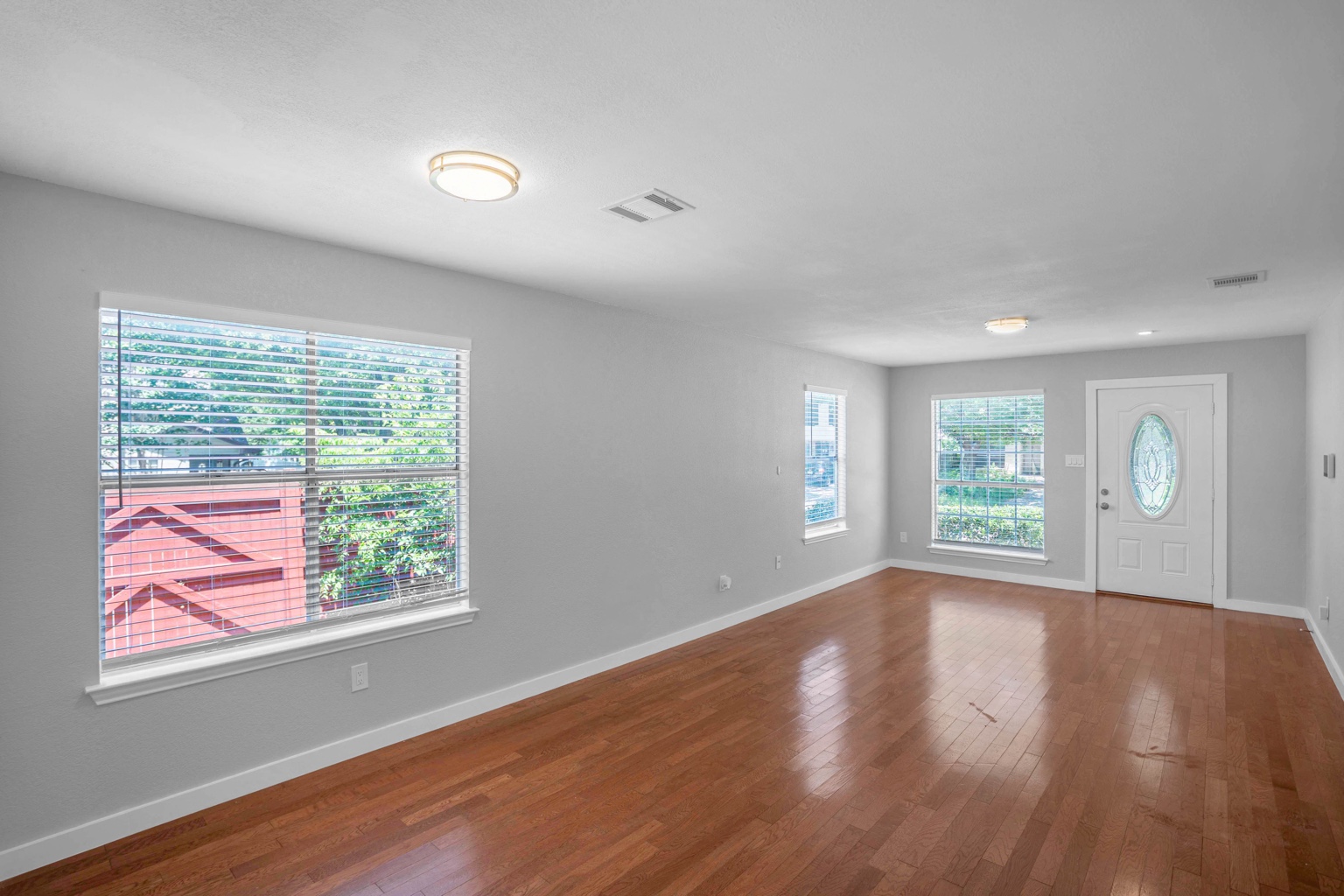800 Smoke Signal Pass Pflugerville, TX 78660 - Photo 28 of 40 Hardwood floors and generous windows illuminate this inviting living space.