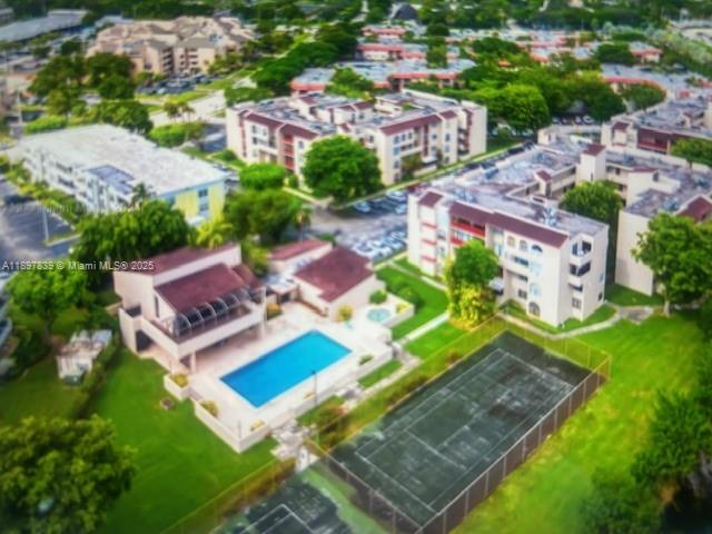 10661 Southwest 108th Avenue, Unit 2E Miami, FL 33176 - Photo 2 of 33 an aerial view of a house with a garden