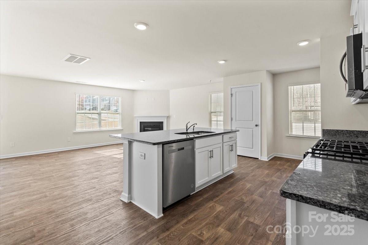 5043 Fandango Road York, SC 29745 - Photo 11 of 34 a kitchen with sink a stove and cabinets