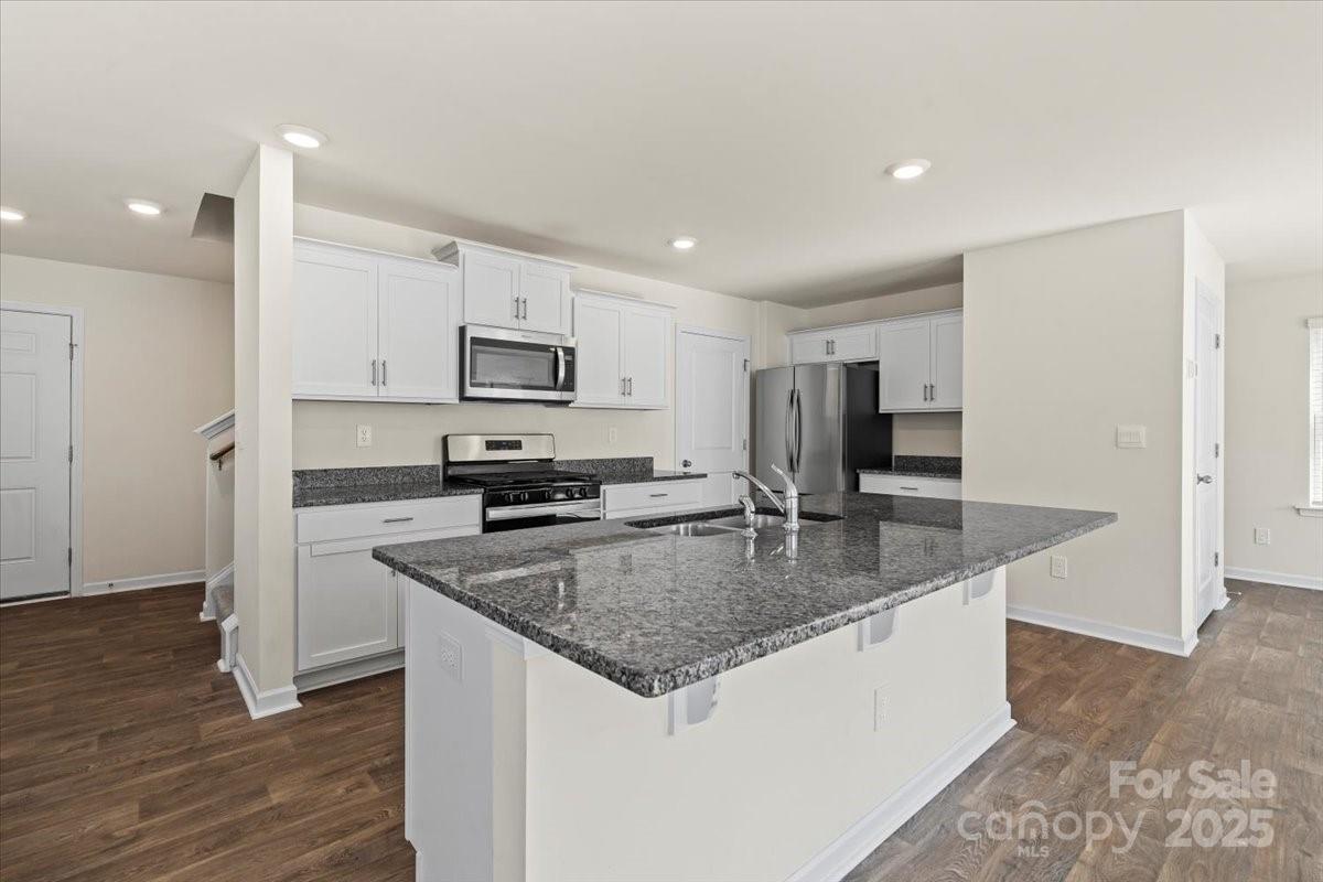 5043 Fandango Road York, SC 29745 - Photo 13 of 34 a kitchen with stainless steel appliances granite countertop a sink dishwasher a refrigerator and a stove
