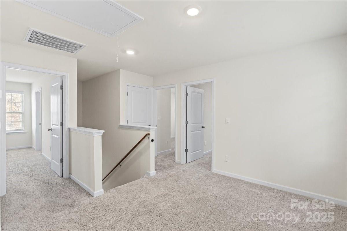 5043 Fandango Road York, SC 29745 - Photo 15 of 34 an empty room with white walls and stairs