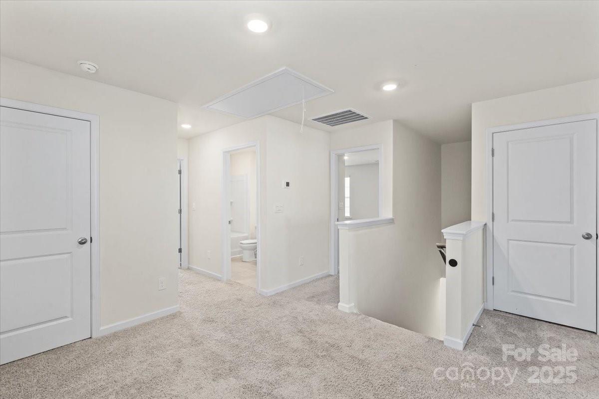 5043 Fandango Road York, SC 29745 - Photo 16 of 34 an empty room with closet and wooden door