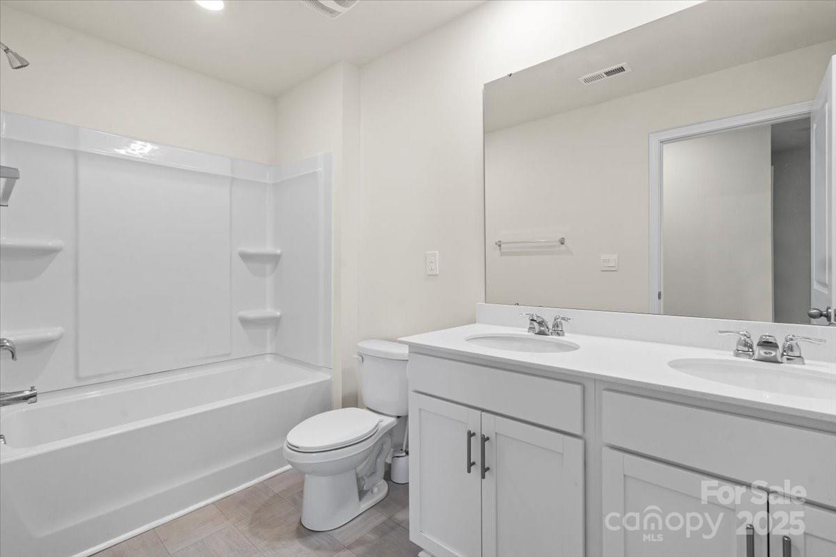 5043 Fandango Road York, SC 29745 - Photo 27 of 34 a bathroom with a sink a toilet and a bathtub