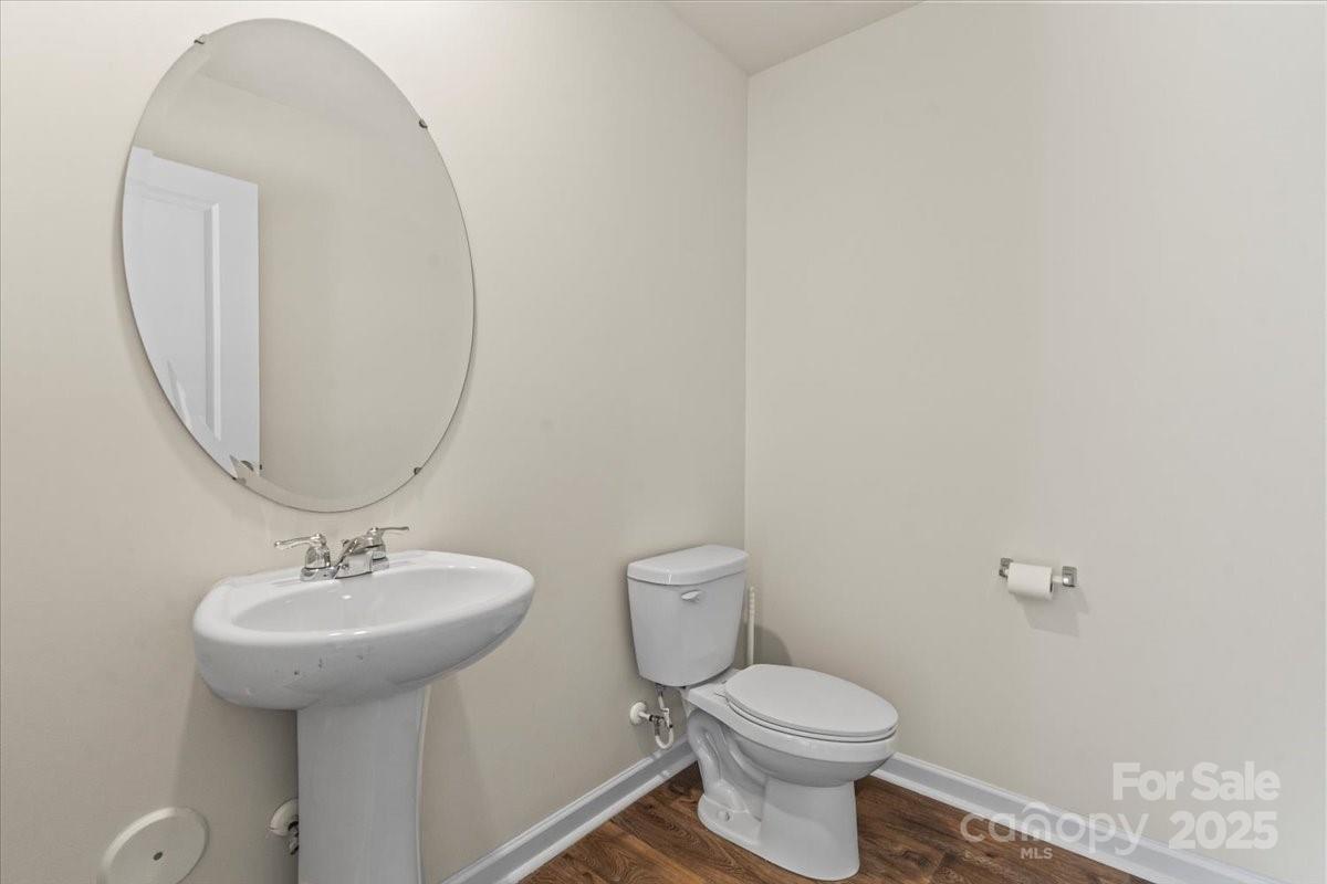 5043 Fandango Road York, SC 29745 - Photo 30 of 34 a bathroom with a toilet sink and mirror