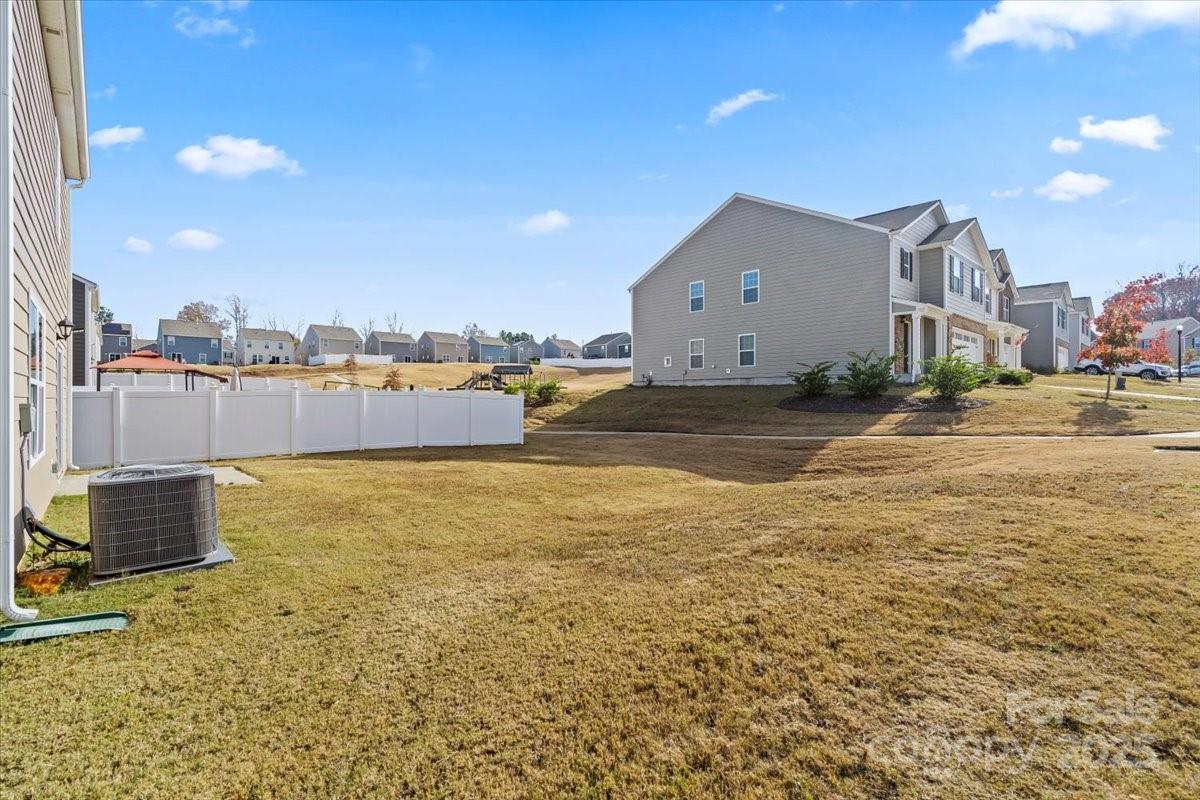 5043 Fandango Road York, SC 29745 - Photo 34 of 34 a view of a lake with a building in the background