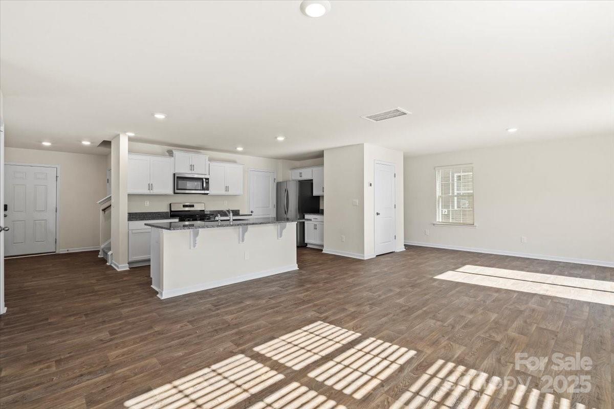 5043 Fandango Road York, SC 29745 - Photo 5 of 34 a view of kitchen with stainless steel appliances kitchen island a refrigerator sink and cabinets