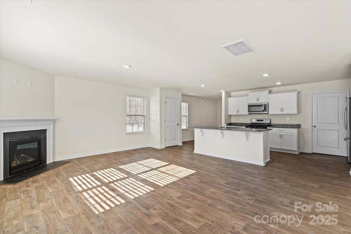 5043 Fandango Road York, SC 29745 - Photo 6 of 34 a view of kitchen with granite countertop stove top oven and cabinets