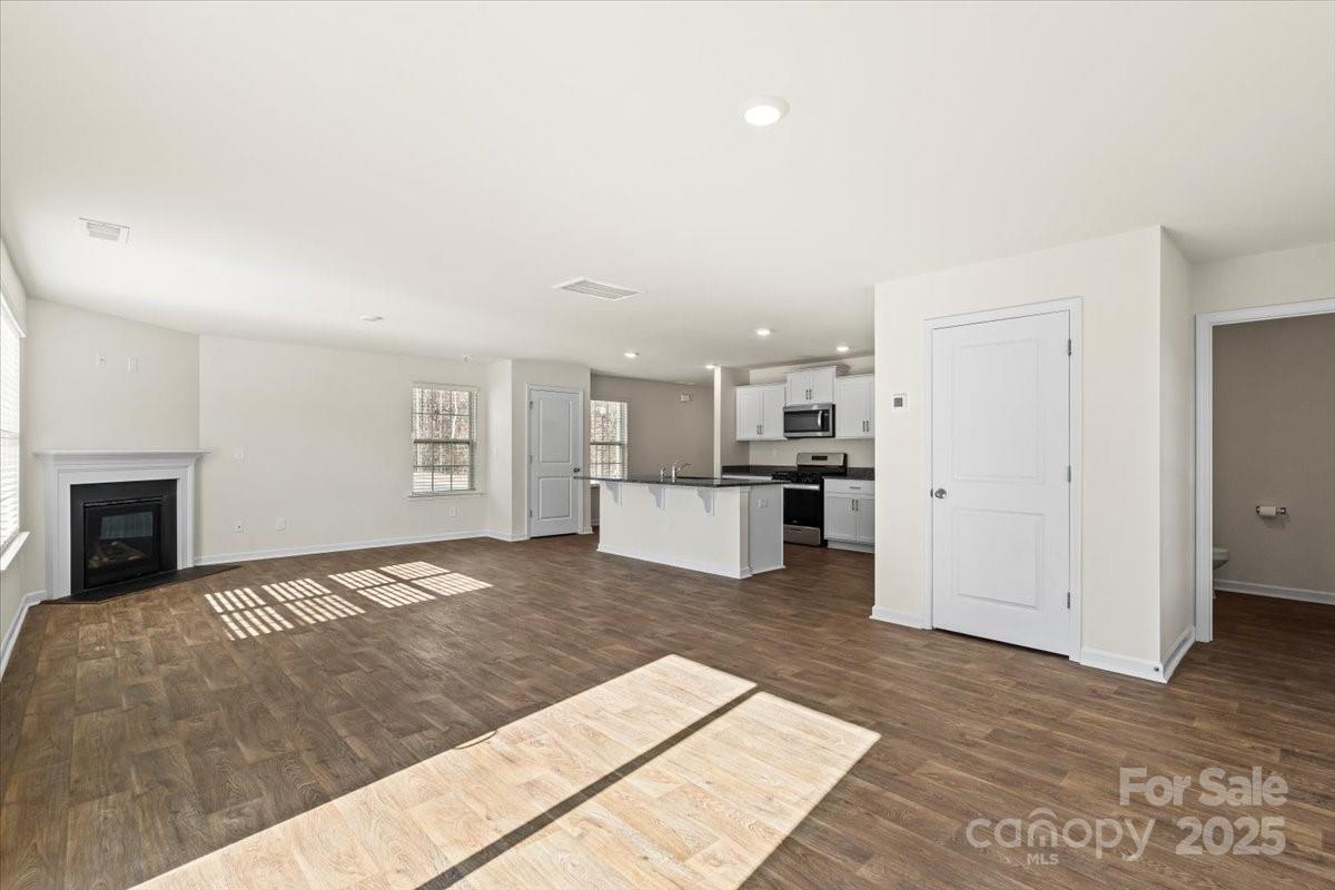 5043 Fandango Road York, SC 29745 - Photo 8 of 34 a view of a kitchen with a sink and a refrigerator