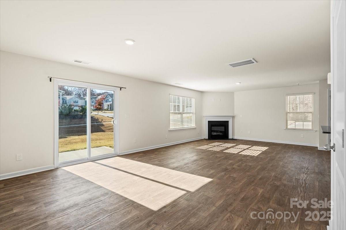 5043 Fandango Road York, SC 29745 - Photo 9 of 34 a view of an empty room with a window and fireplace