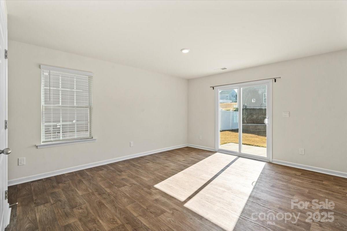 5043 Fandango Road York, SC 29745 - Photo 10 of 34 an empty room with wooden floor and windows