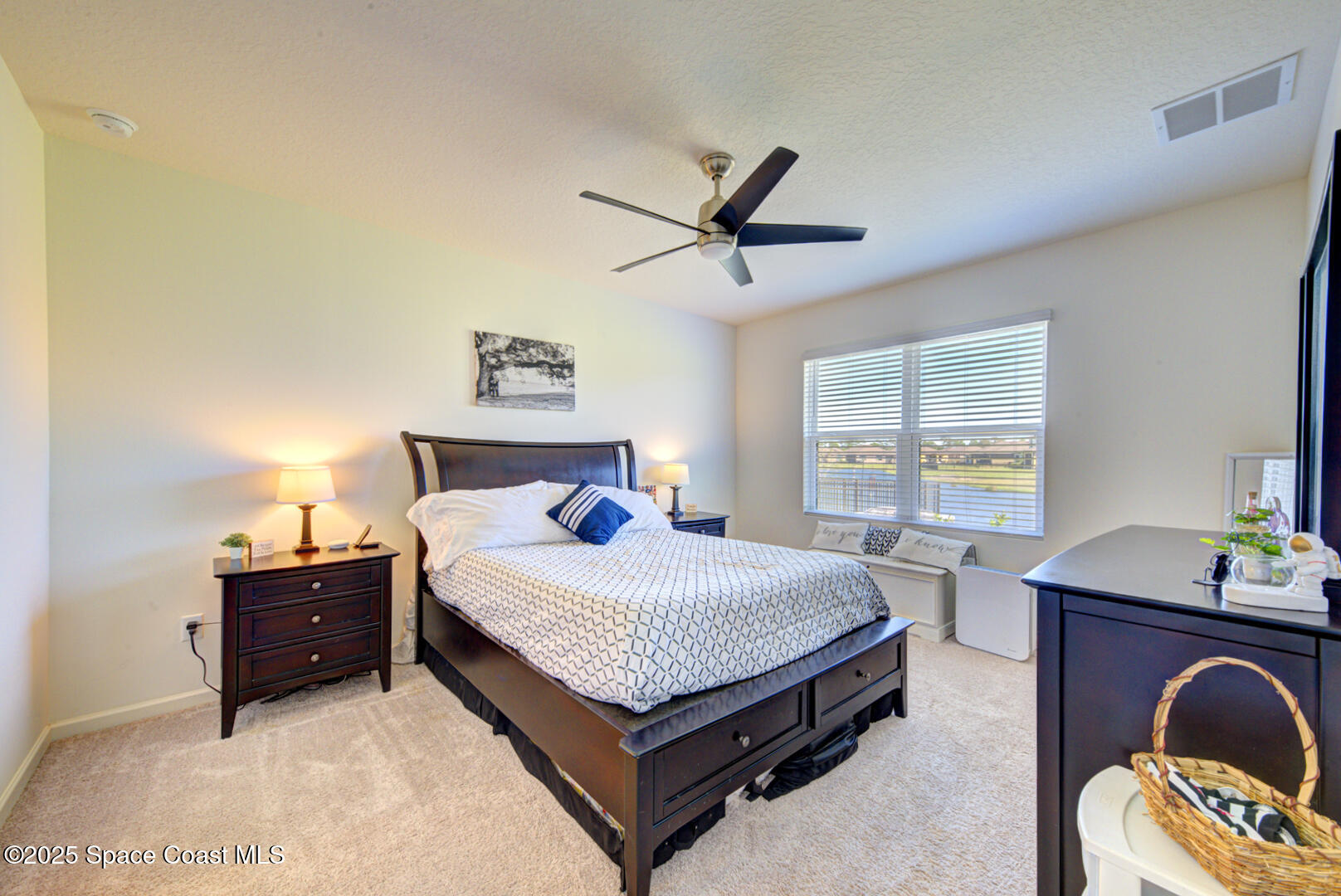 4941 Talbot Boulevard Cocoa, FL 32926 - Photo 27 of 48 a bedroom with a bed and a desk