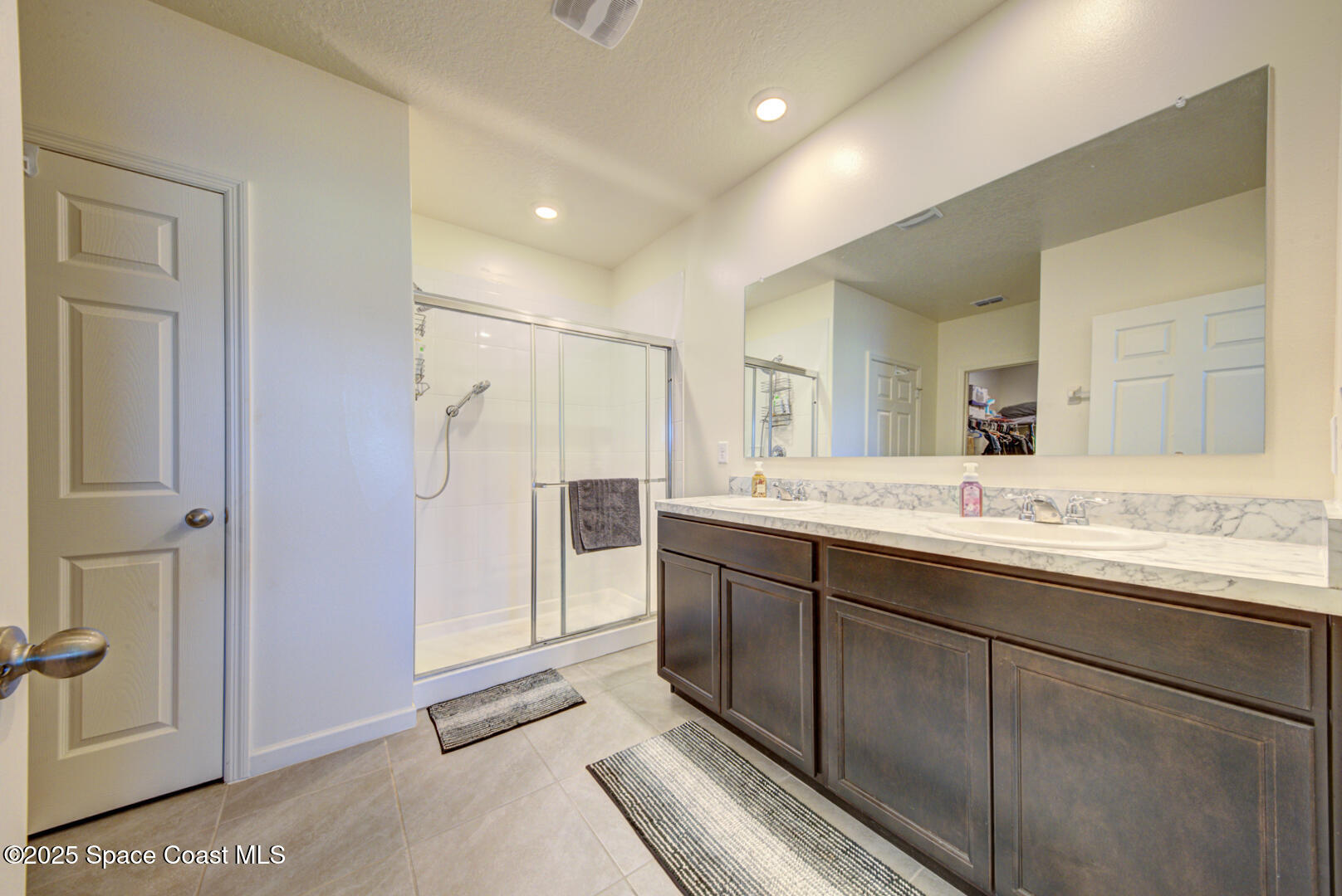 4941 Talbot Boulevard Cocoa, FL 32926 - Photo 29 of 48 a bathroom with a sink and a mirror
