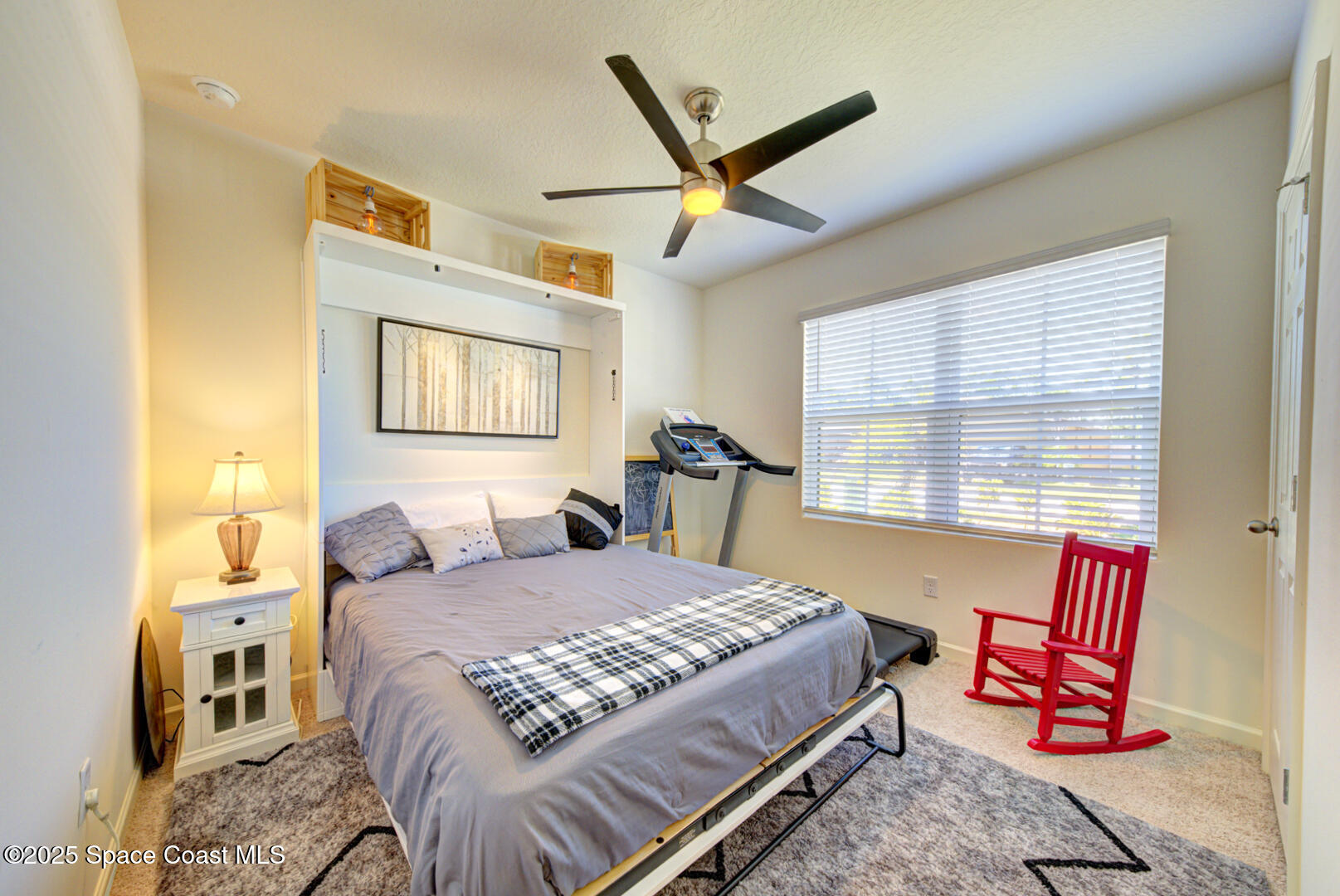 4941 Talbot Boulevard Cocoa, FL 32926 - Photo 4 of 48 a bedroom with a bed a chandelier and a dresser