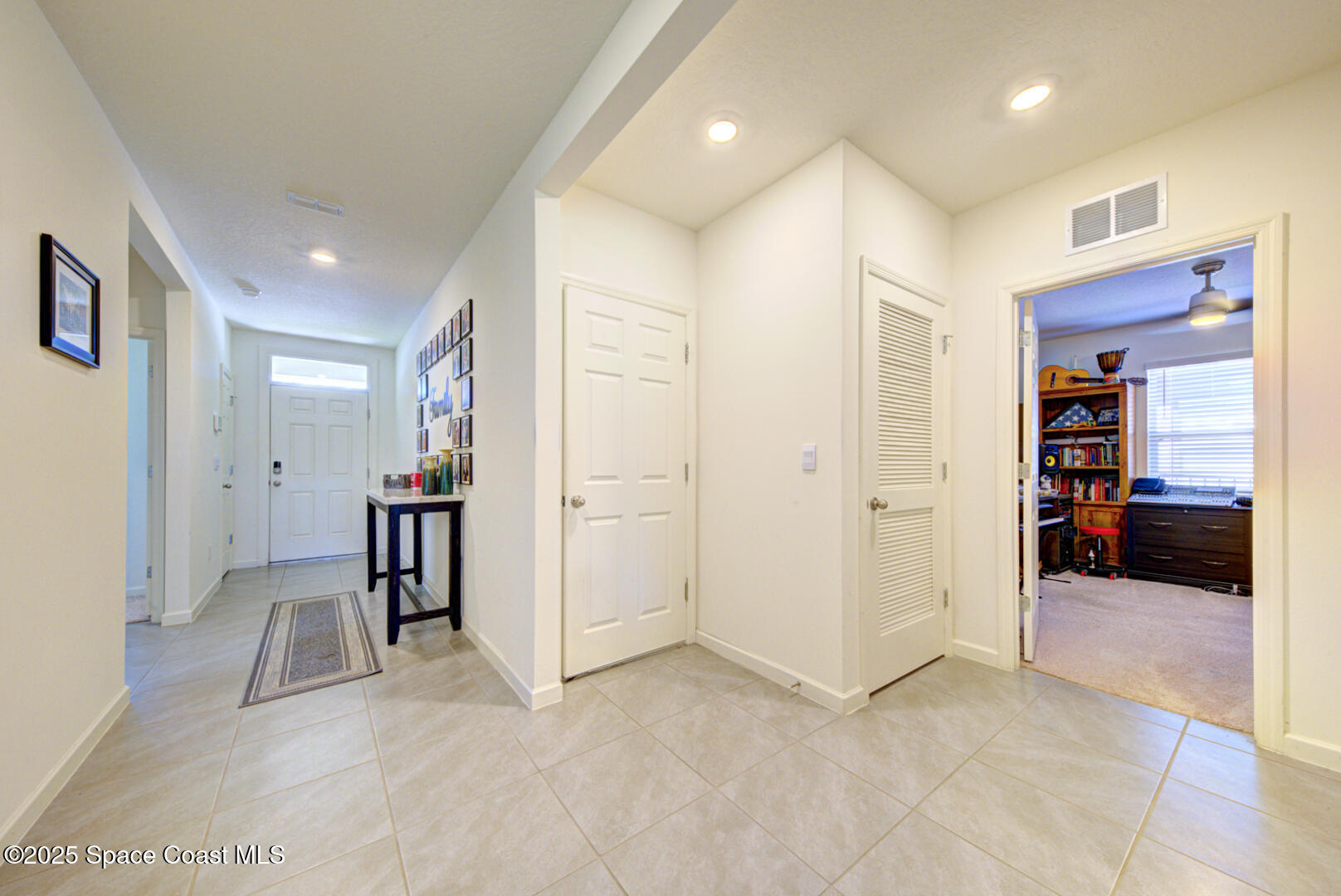 4941 Talbot Boulevard Cocoa, FL 32926 - Photo 10 of 48 a view of a hallway with furniture and closet area