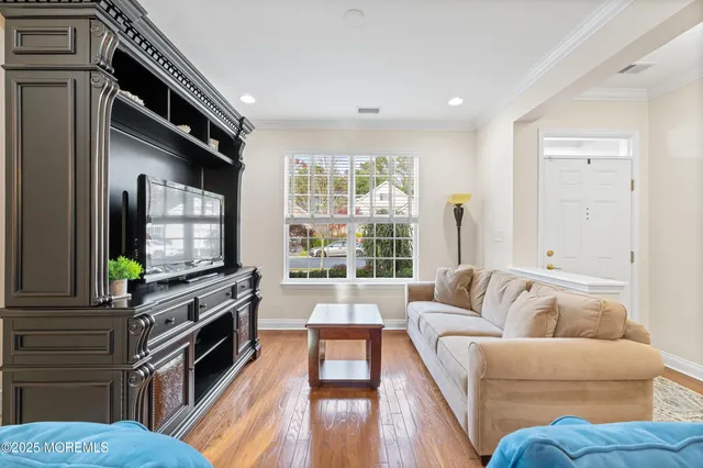 a living room with furniture a couch and a coffee table