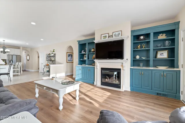 a livingroom with furniture wooden floor and window