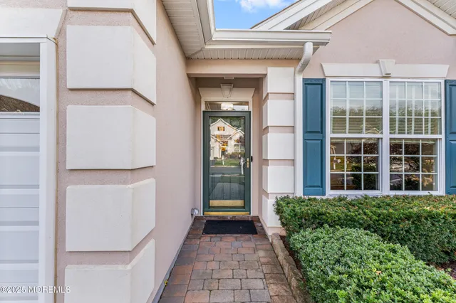 a view of a house with backyard sitting area and garden