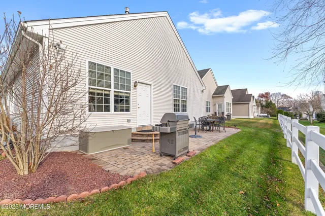 a view of a chair and tables in the patio