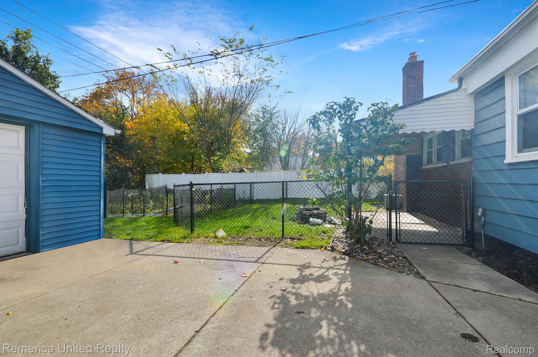 Fenced area with covered patio