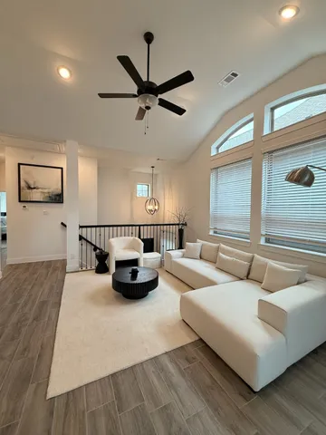 a living room with furniture and a large window