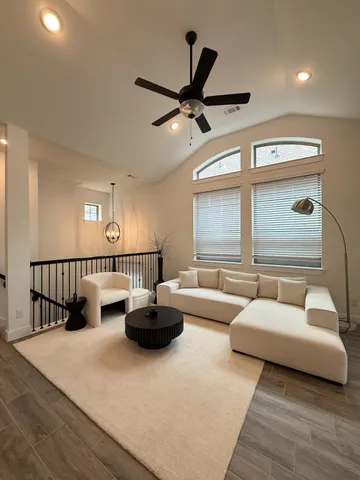 a living room with furniture and a large window
