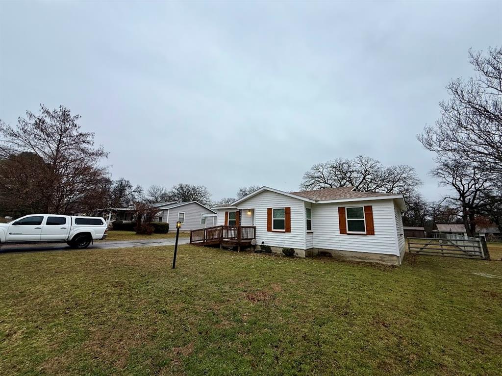 133 Gordon Drive Azle, TX 76020 - Photo 2 of 29 a view of a house with a yard and sitting area