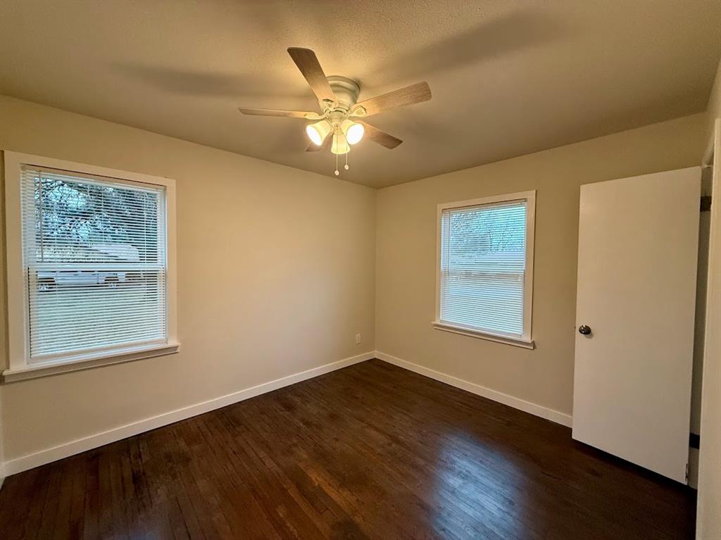 133 Gordon Drive Azle, TX 76020 - Photo 25 of 29 a view of an empty room with wooden floor and a window