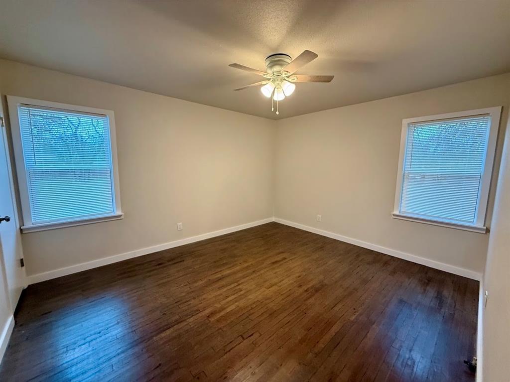 133 Gordon Drive Azle, TX 76020 - Photo 27 of 29 a view of an empty room with wooden floor and a window