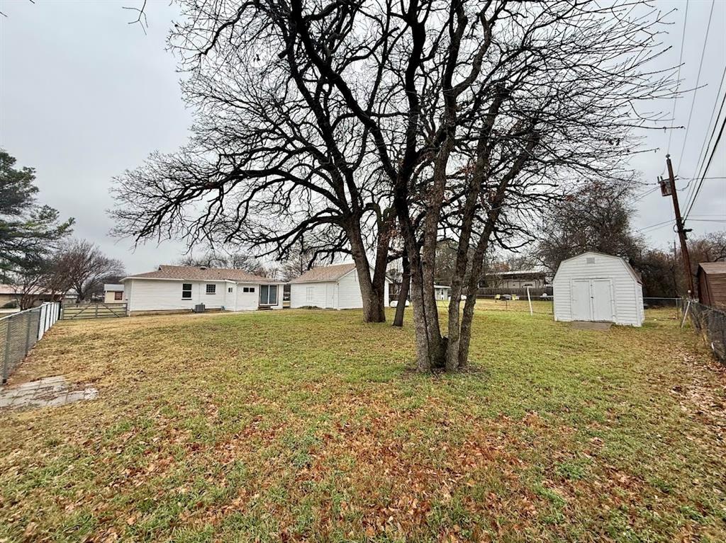 133 Gordon Drive Azle, TX 76020 - Photo 7 of 29 a fire hydrant in front of a white house