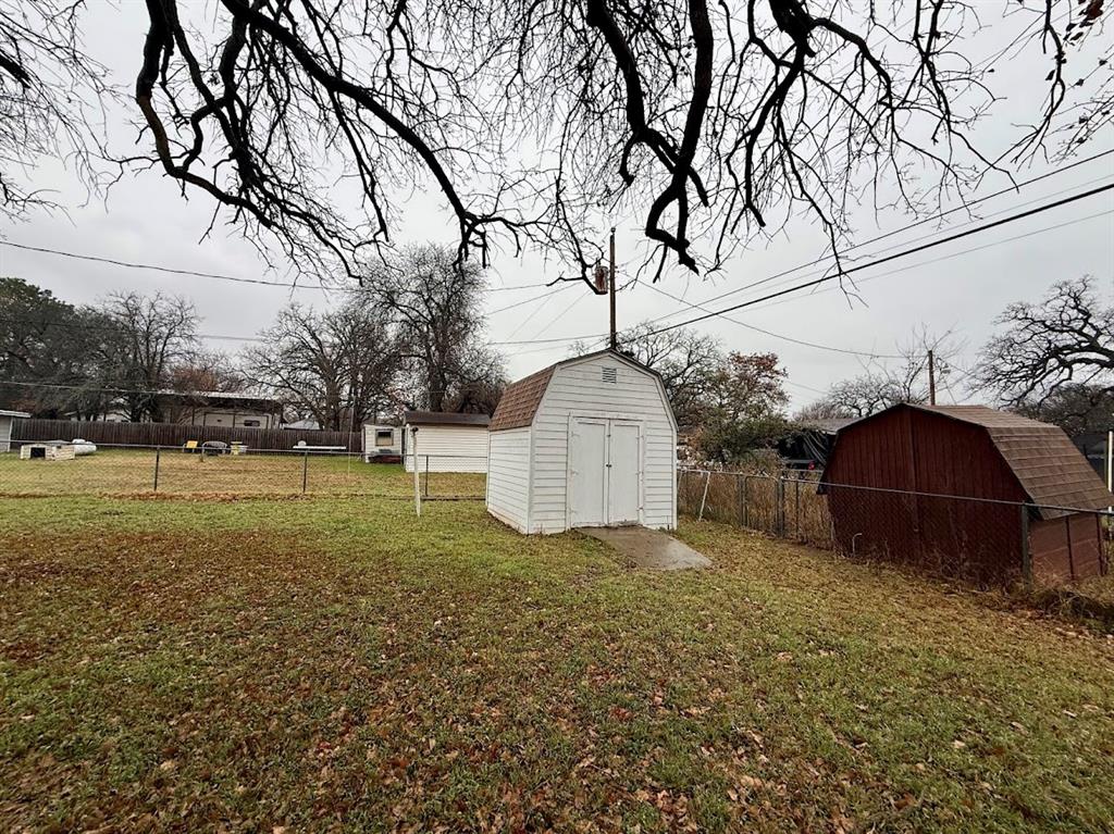 133 Gordon Drive Azle, TX 76020 - Photo 9 of 29 a view of backyard with tree