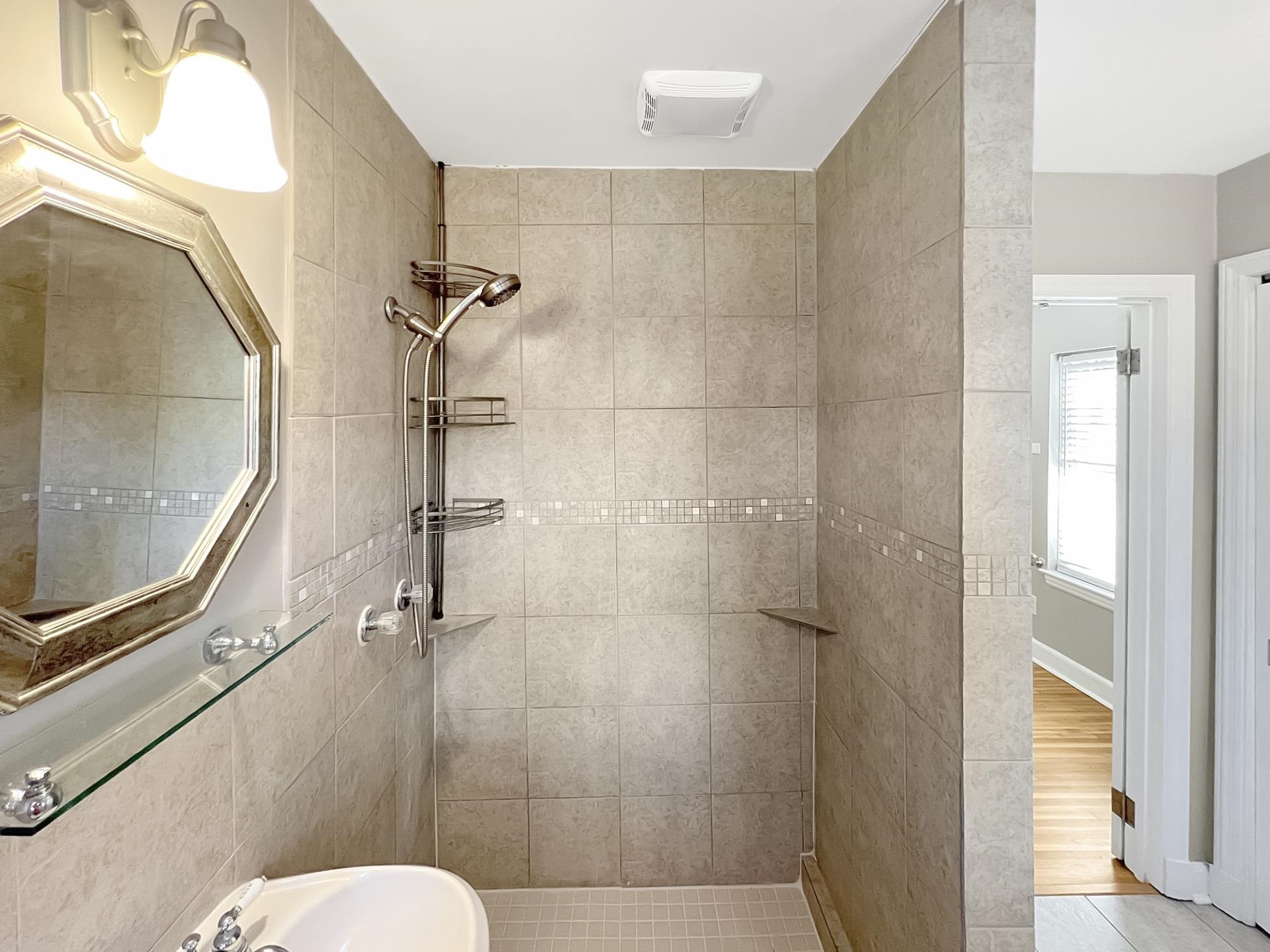 1049 South Perkins Road Memphis, TN 38117 - Photo 17 of 23 a bathroom with a toilet and a shower