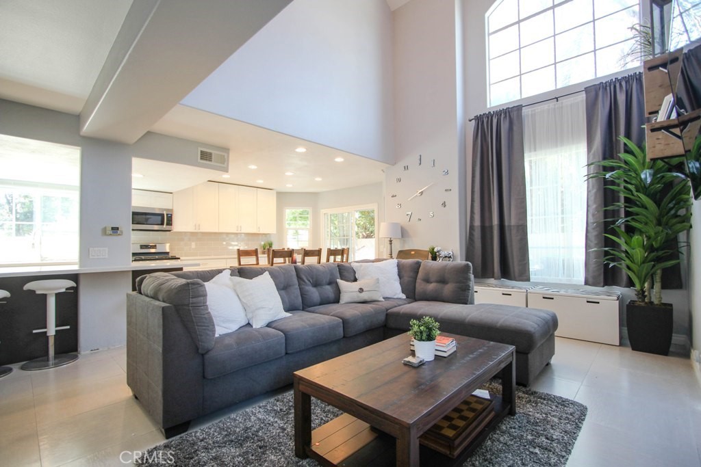 1920 Maple Avenue, Unit A Costa Mesa, CA 92627 - Photo 1 of 35 a living room with furniture and a large window