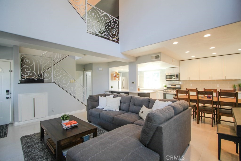 1920 Maple Avenue, Unit A Costa Mesa, CA 92627 - Photo 13 of 35 a living room with furniture and a view of kitchen