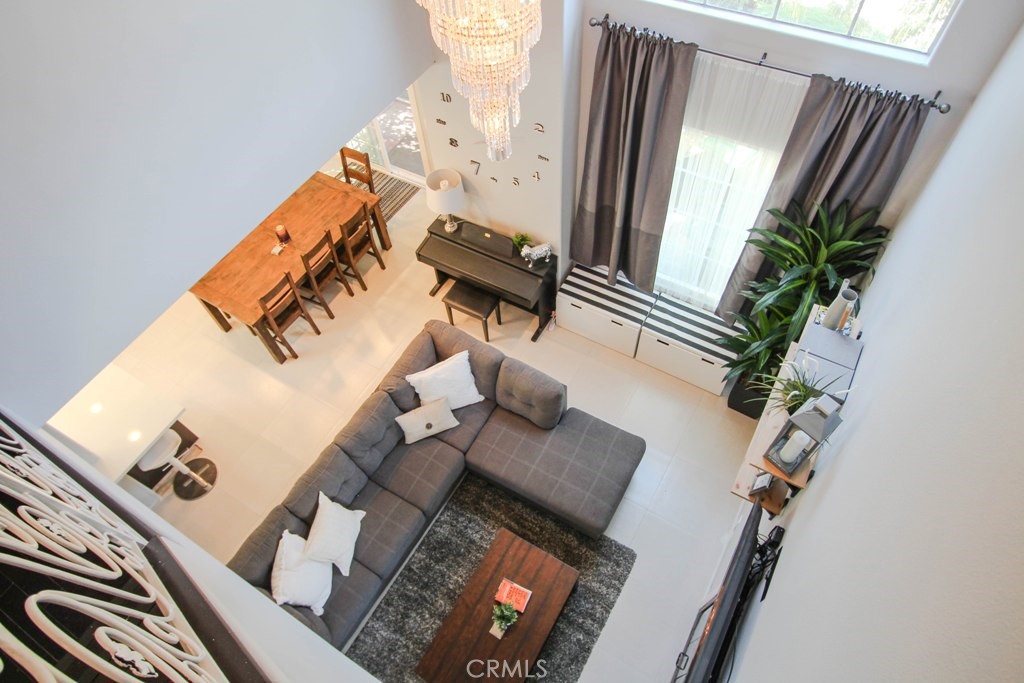 1920 Maple Avenue, Unit A Costa Mesa, CA 92627 - Photo 18 of 35 a living room with furniture and a floor to ceiling window
