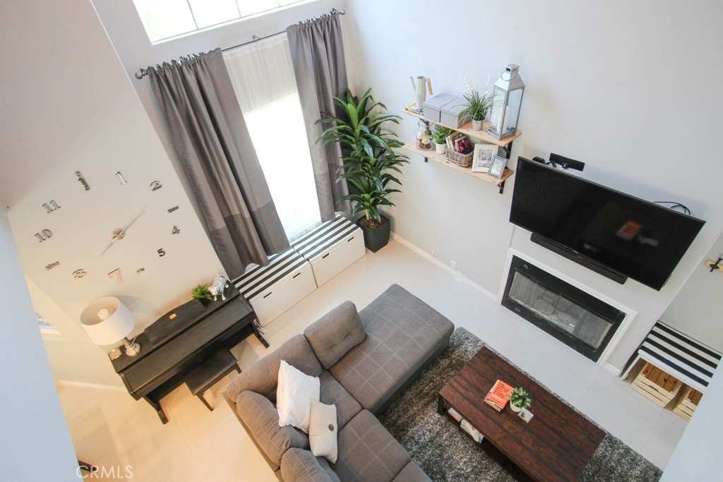1920 Maple Avenue, Unit A Costa Mesa, CA 92627 - Photo 19 of 35 a living room with furniture and a flat screen tv