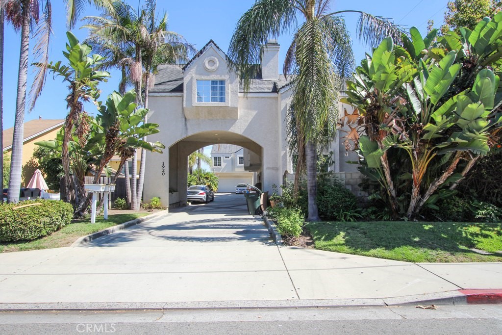 1920 Maple Avenue, Unit A Costa Mesa, CA 92627 - Photo 2 of 35 a front view of a house with a garden