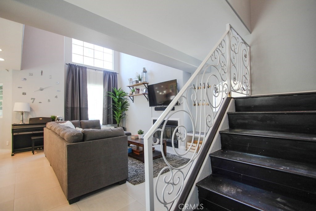 1920 Maple Avenue, Unit A Costa Mesa, CA 92627 - Photo 23 of 35 a living room with furniture or stairs and a window