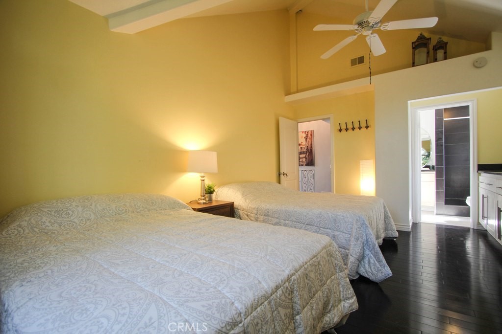 1920 Maple Avenue, Unit A Costa Mesa, CA 92627 - Photo 27 of 35 a bedroom with a bed and a walk in closet