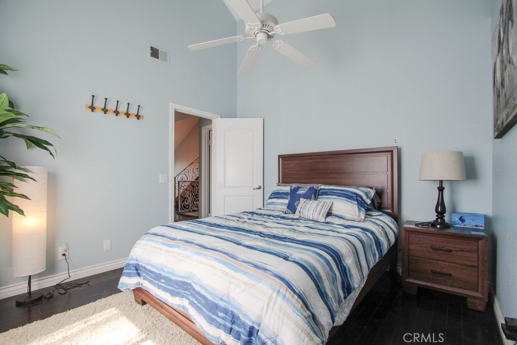 1920 Maple Avenue, Unit A Costa Mesa, CA 92627 - Photo 30 of 35 a bedroom with a bed and a night stand