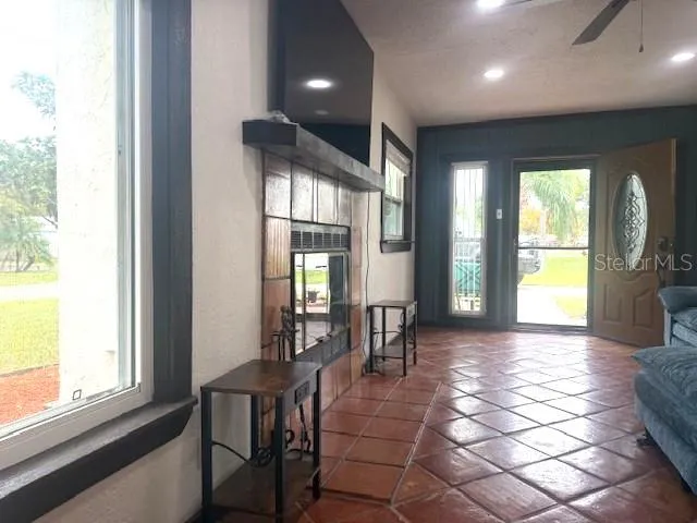 a view of a dining room with furniture and a window