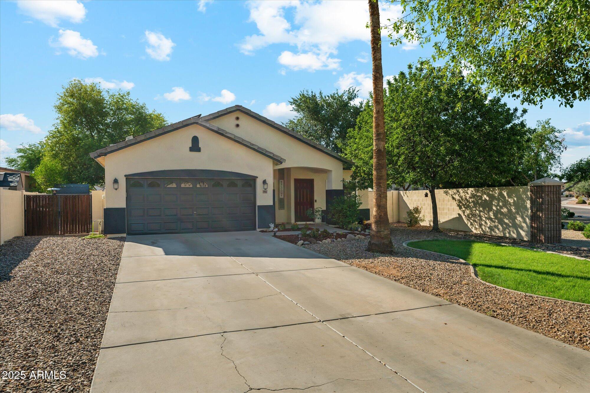 1924 South Rome Street Gilbert, AZ 85295 - Photo 11 of 60 a front view of a house with a yard and garage