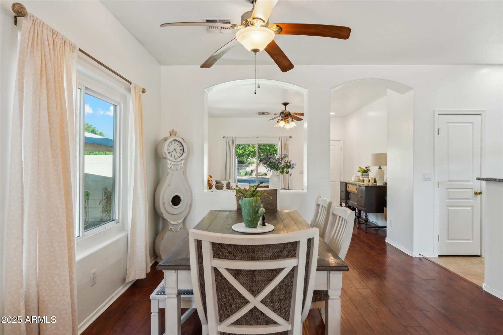 1924 South Rome Street Gilbert, AZ 85295 - Photo 15 of 60 a dining room with furniture a window and wooden floor