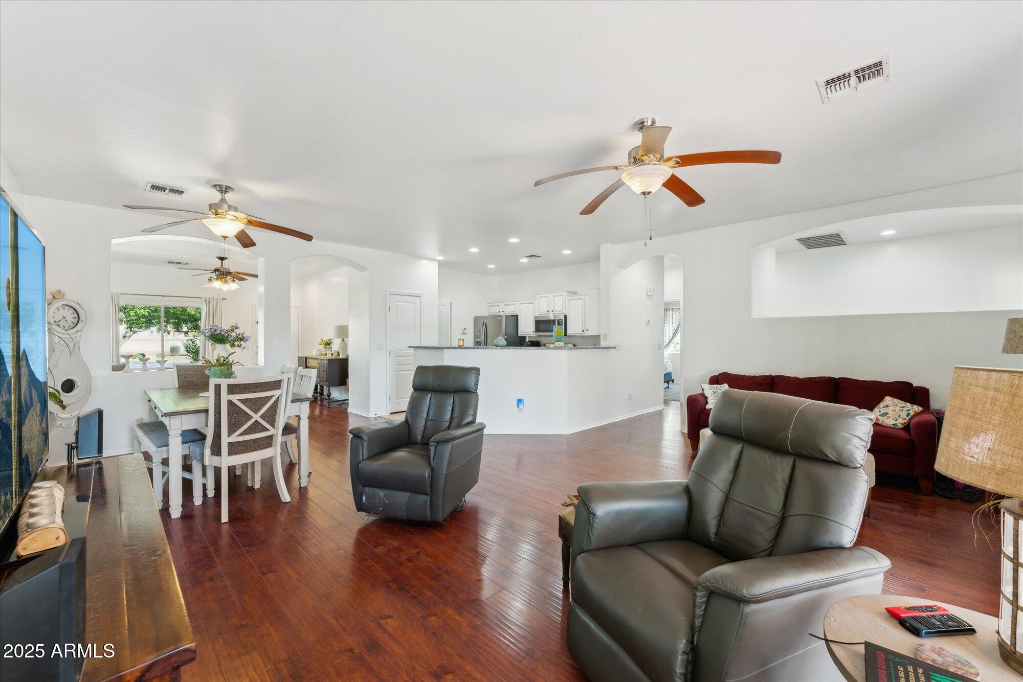 1924 South Rome Street Gilbert, AZ 85295 - Photo 16 of 60 a living room with furniture kitchen view and a wooden floor