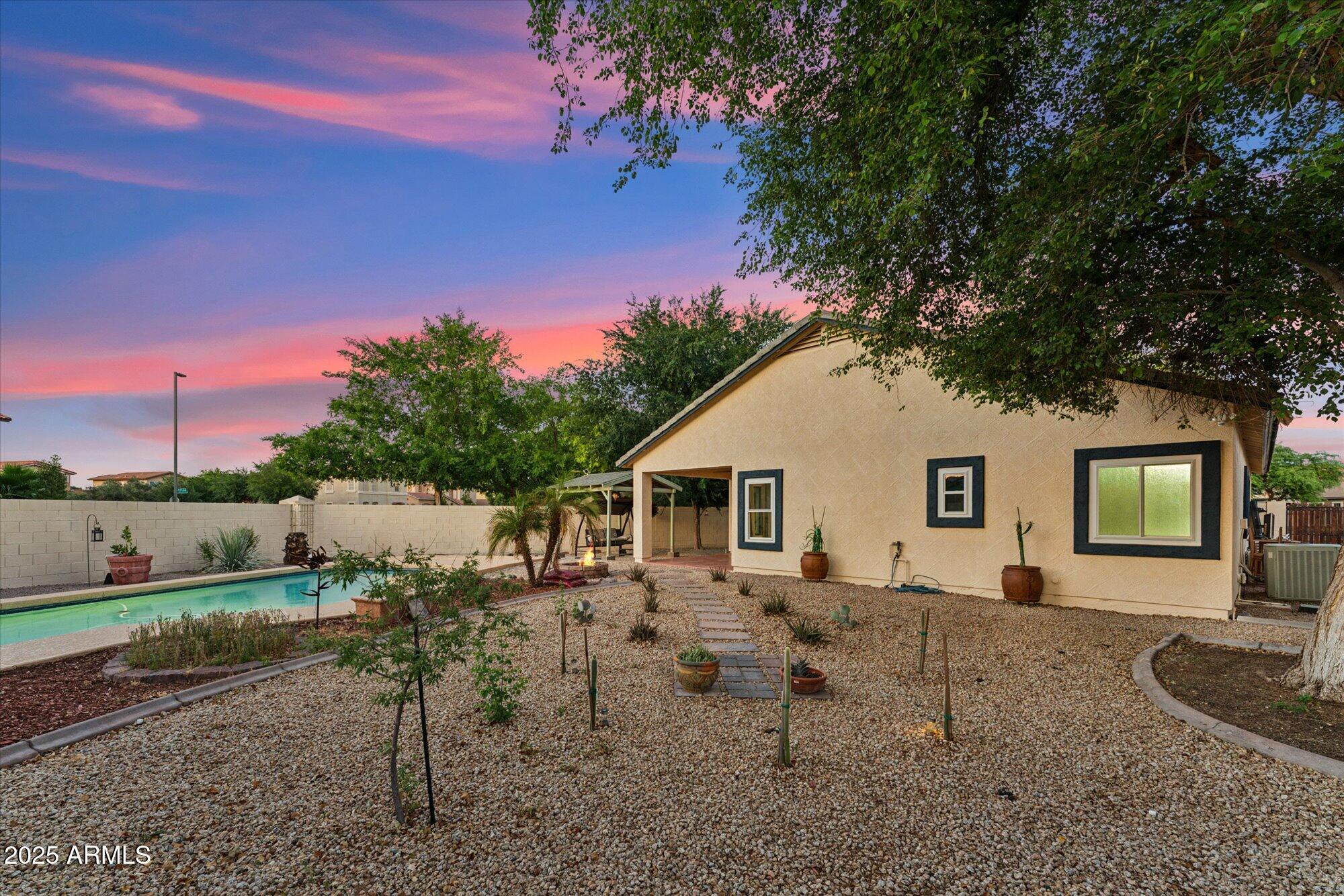 1924 South Rome Street Gilbert, AZ 85295 - Photo 17 of 60 a backyard of a house with table and chairs